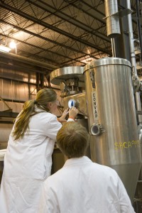 Two researchers, a blond male and a blond female, at work in UMaine's Technology Research Center