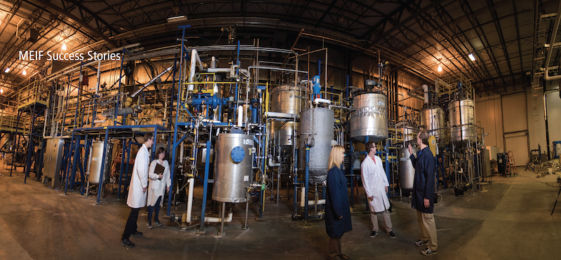 A wide-angle photograph of researchers standing in FBRI's technology research center.