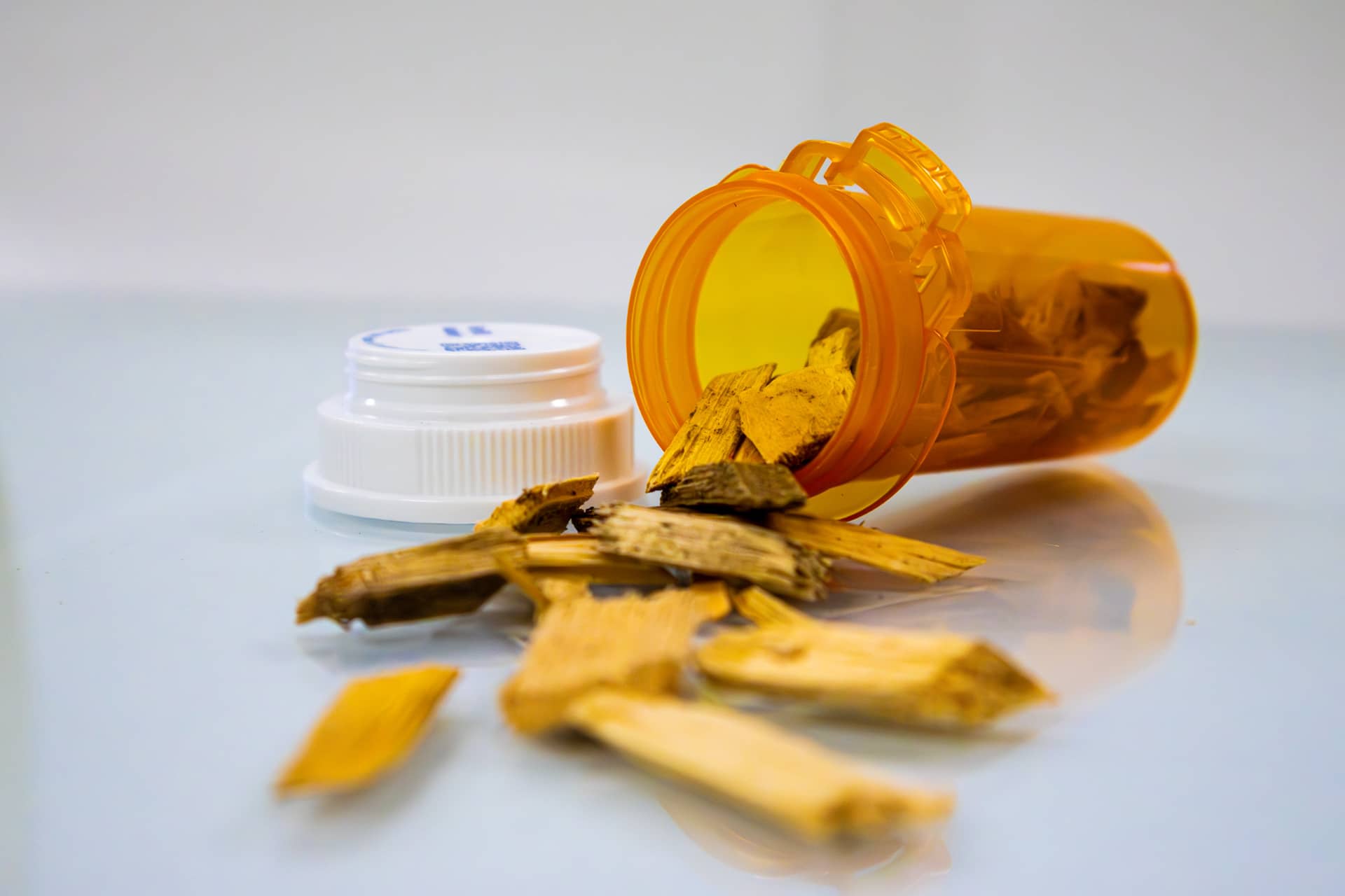 pill bottle with wood chips